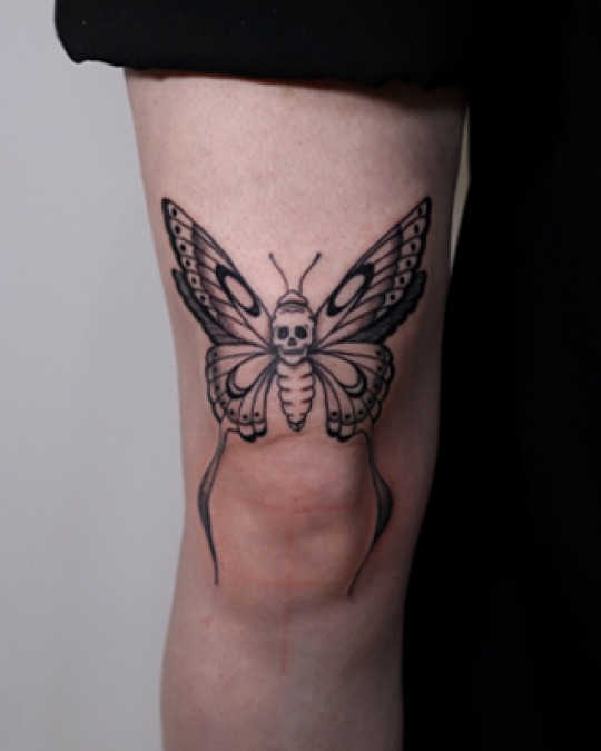Feminine moth tattoo